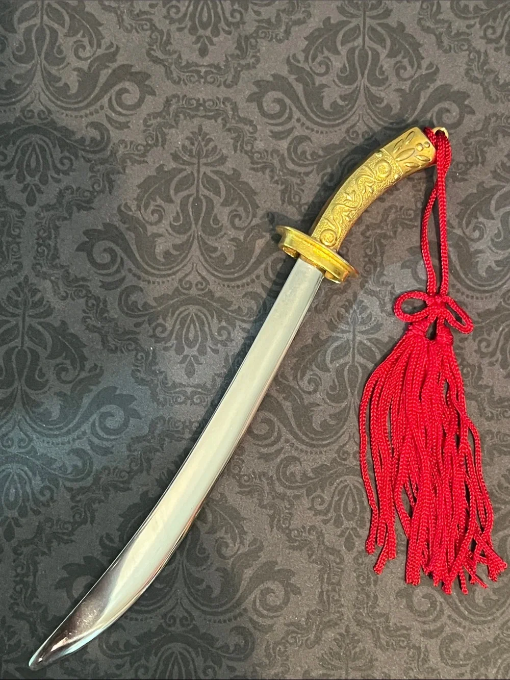Decorative Gold-Tone Mini Scimitar Letter Opener with Red Tassel